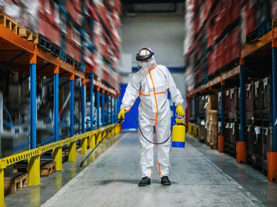 man-worker-with-protective-mask-and-suit-disinfect-KC65YR5